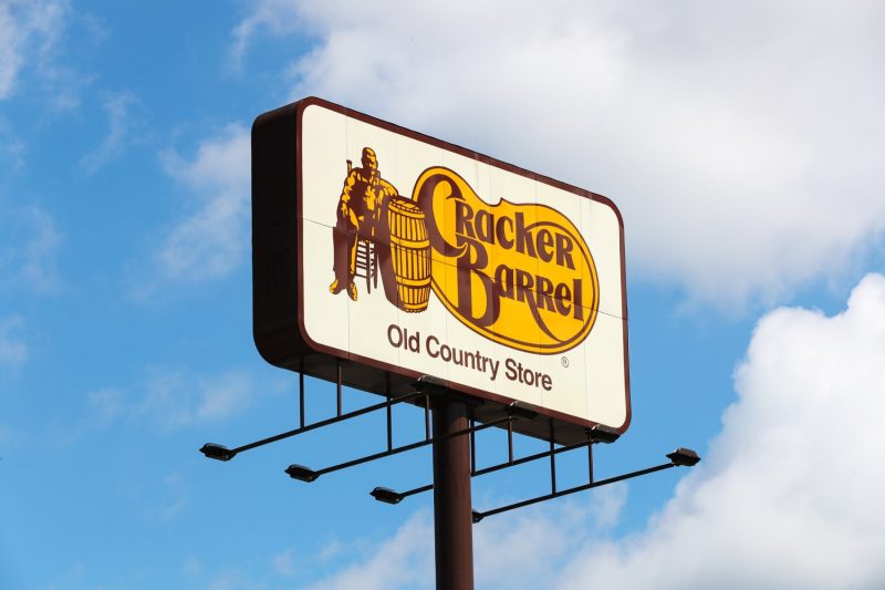 Shares of Cracker Barrel Old Country Store plummeted roughly 10% on Thursday after the restaurant unveiled its new logo earlier this week as part of a larger brand refresh.
The new logo removes the image of a man leaning against a barrel that was prominently featured in the original, leaving behind just the words Cracker Barrel against a yellow background. The phrase “old country store” has also been removed.
The company said the colors in the logo were inspired by the chain’s scrambled eggs and biscuits.
Cracker Barrel’s new logo.Cracker Barrel
The change is part of a “strategic transformation” to revitalize the brand that started back in May 2024. Under that mission, Cracker Barrel’s brand refresh includes updates to visual elements, restaurant spaces and food and retail offerings.
Cracker Barrel said in March that the refresh will still maintain the brand’s “rich history of country hospitality” and “authentic charm that has made the brand a beloved destination for generations of families.”
“We believe in the goodness of country hospitality, a spirit that has always defined us. Our story hasn’t changed. Our values haven’t changed,” Chief Marketing Officer Sarah Moore said in a media release.
However, many social media users have criticized the new logo, especially those in conservative circles. The president’s son, Donald Trump Jr., amplified a post on Wednesday suggesting that the logo change was led by CEO Julie Felss Masino to erase the American tradition aspect of the branding and make it more general, as a way of leaning into diversity, equity and inclusion efforts.
Conservative activist Robby Starbuck added his commentary on Thursday, writing in a post on X, “Good morning @CrackerBarrel! You’re about to learn that wokeness really doesn’t pay.”
The company has a relatively small market cap of about $1.2 billion compared with other restaurant chains.
Customers have also complained on social media about the interior redesign of many Cracker Barrel restaurants, saying that the new decor favors a more sterile and modern style over its tried-and-true country feel.
On the restaurant’s latest earnings call in June, Masino said Cracker Barrel had completed 20 remodels and 20 refreshes. She said the company will be sharing more information about the remodeling initiative in September.
“Employees had given us great feedback about working in those newly remodeled and refreshed stores and guests continue to tell us that they’re lighter, brighter, more welcoming and they’re enjoying them,” Masino said on the call.
Cracker Barrel is not the only stock to see large swings based on political social media posts.
Earlier this month, shares of American Eagle soared after Trump posted that an ad featuring Sydney Sweeney, which faced significant social media pushback from the left, was “the ‘HOTTEST’ ad out there.”
Back in 2023, Anheuser-Busch InBev faced heavy criticism from conservatives after a collaboration between Bud Light and social influencer Dylan Mulvaney, who is transgender.
This post appeared first on NBC NEWS